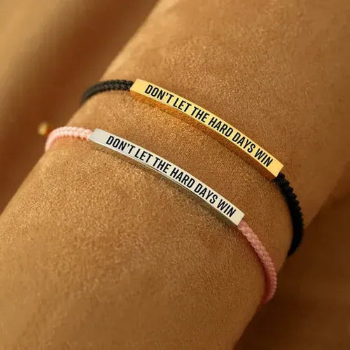 Hard Days bracelet in black and gold, worn
